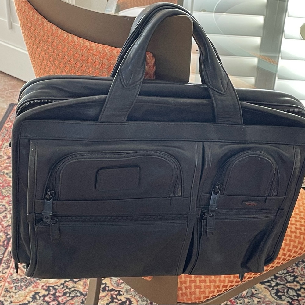 Tumi leather T pass medium laptop bag.Briefcase bag.Lots of pockets .